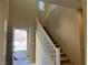 Cozy staircase with carpeted steps and white railings, providing access to the home's upper level at 11467 Monte Isola St, Las Vegas, NV 89141