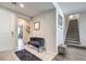 Bright and airy entryway with stylish seating and wood-look floors at 1934 Karner Blue Ave, North Las Vegas, NV 89031