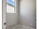 Simple laundry room with washer and dryer at 1934 Karner Blue Ave, North Las Vegas, NV 89031