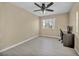 Bright bedroom with wood-look floors, ceiling fan, and workspace at 2134 William Holden Ct, Las Vegas, NV 89142