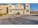 Two-unit townhouse building with garages and landscaping at 2134 William Holden Ct, Las Vegas, NV 89142