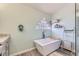 Relaxing bathroom with a free-standing tub and a block window at 3245 W Landberg Ave, Las Vegas, NV 89141