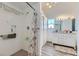 Walk-in shower with tiled walls and a shower curtain at 3245 W Landberg Ave, Las Vegas, NV 89141