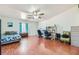 Bright bedroom with hardwood floors, a desk, and two chairs at 3245 W Landberg Ave, Las Vegas, NV 89141