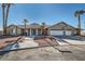 Beautiful single-story home with a three-car garage and mature landscaping at 3245 W Landberg Ave, Las Vegas, NV 89141