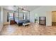 Main bedroom with tile floors, a four-poster bed, and ensuite bathroom at 3245 W Landberg Ave, Las Vegas, NV 89141