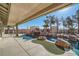 Inviting pool and spa with a waterfall feature and expansive patio at 3245 W Landberg Ave, Las Vegas, NV 89141
