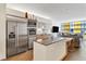 Contemporary kitchen with stainless steel appliances and a stylish island with counter seating at 3722 Las Vegas Blvd # 2309, Las Vegas, NV 89158