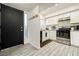Kitchen entry with black door and white cabinets at 4045 Village Sq, Las Vegas, NV 89121