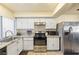 Modern kitchen featuring stainless steel appliances and granite countertops at 4045 Village Sq, Las Vegas, NV 89121