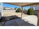 Large backyard with covered patio and mature shrubs at 5402 Night Swim Ln, Las Vegas, NV 89113
