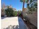 Backyard with block wall, landscaping, and patio at 5402 Night Swim Ln, Las Vegas, NV 89113