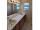 Clean bathroom with double vanity and mirror at 5402 Night Swim Ln, Las Vegas, NV 89113