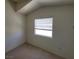 Cozy bedroom with window and neutral walls at 5402 Night Swim Ln, Las Vegas, NV 89113
