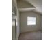 Bright bedroom with vaulted ceiling and window at 5402 Night Swim Ln, Las Vegas, NV 89113