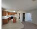 Open kitchen with island, light cabinets, and views to Gathering room at 5402 Night Swim Ln, Las Vegas, NV 89113