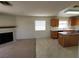 Kitchen with island, fireplace, and access to backyard at 5402 Night Swim Ln, Las Vegas, NV 89113