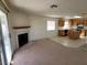 Living room with fireplace and sliding door to patio at 5402 Night Swim Ln, Las Vegas, NV 89113