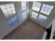 High ceiling living room with large windows and view from above at 5402 Night Swim Ln, Las Vegas, NV 89113