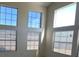 Spacious living room featuring large windows and high ceilings at 5402 Night Swim Ln, Las Vegas, NV 89113