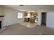 Living room with fireplace and view to kitchen at 5402 Night Swim Ln, Las Vegas, NV 89113