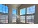 Spacious living room with abundant natural light from large windows at 5402 Night Swim Ln, Las Vegas, NV 89113