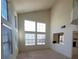 Spacious living room with high ceilings and large windows at 5402 Night Swim Ln, Las Vegas, NV 89113