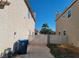 Side yard with a gate and a blue recycling bin at 5402 Night Swim Ln, Las Vegas, NV 89113