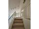 Upper level hallway with railing overlooking lower level at 5402 Night Swim Ln, Las Vegas, NV 89113