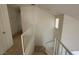 Upper level hallway with railing and access to bedrooms at 5402 Night Swim Ln, Las Vegas, NV 89113