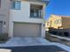 Tan two story home with attached garage and balcony at 7368 N Decatur Blvd # 1, Las Vegas, NV 89131