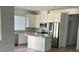 Modern kitchen with island, stainless steel appliances, and white cabinets at 7368 N Decatur Blvd # 1, Las Vegas, NV 89131