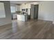 Open concept kitchen with island and stainless steel appliances at 7368 N Decatur Blvd # 1, Las Vegas, NV 89131
