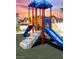 Community playground with two slides and climbing structure at 7368 N Decatur Blvd # 1, Las Vegas, NV 89131