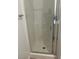 Clean white tiled shower with glass enclosure at 7368 N Decatur Blvd # 1, Las Vegas, NV 89131