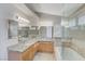 Double vanity bathroom with granite countertops and large mirrors at 7633 Falconwing Ave, Las Vegas, NV 89131