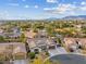 Aerial view of neighborhood, showcasing house and surrounding homes at 8229 Flowing Rapids Ct, Las Vegas, NV 89131