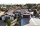 Single-story house with a two-car garage and nicely landscaped yard at 8229 Flowing Rapids Ct, Las Vegas, NV 89131