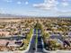 Aerial view of suburban neighborhood with tree-lined streets at 8229 Flowing Rapids Ct, Las Vegas, NV 89131
