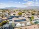 Home with solar panels and a view of the neighborhood and mountains at 8229 Flowing Rapids Ct, Las Vegas, NV 89131
