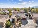 House with solar panels and a view of the surrounding neighborhood and mountains at 8229 Flowing Rapids Ct, Las Vegas, NV 89131