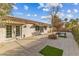 Backyard with patio, landscaping, and access from sliding doors at 8229 Flowing Rapids Ct, Las Vegas, NV 89131