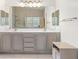 Elegant bathroom with double vanity and large mirror at 8229 Flowing Rapids Ct, Las Vegas, NV 89131