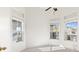 Bright bedroom with three windows and neutral-colored walls at 8229 Flowing Rapids Ct, Las Vegas, NV 89131