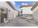 Private courtyard with white iron furniture, perfect for relaxing at 8229 Flowing Rapids Ct, Las Vegas, NV 89131