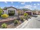 Single-story home with attractive landscaping and a two-car garage at 8229 Flowing Rapids Ct, Las Vegas, NV 89131
