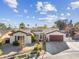 Single-story home with attached garage and landscaping at 8229 Flowing Rapids Ct, Las Vegas, NV 89131