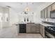 Modern kitchen with island and stainless steel appliances at 8229 Flowing Rapids Ct, Las Vegas, NV 89131