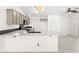 Modern kitchen with a large island and gray cabinets at 8229 Flowing Rapids Ct, Las Vegas, NV 89131