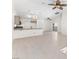 Open concept kitchen and living area with tile floors and modern finishes at 8229 Flowing Rapids Ct, Las Vegas, NV 89131